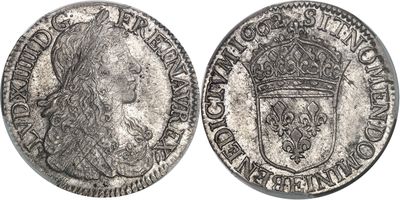 une pièce d'argent surmontée d'une couronne