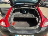 a car with its trunk open in a parking lot