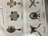 six cards with different types of jewelry on them on a table