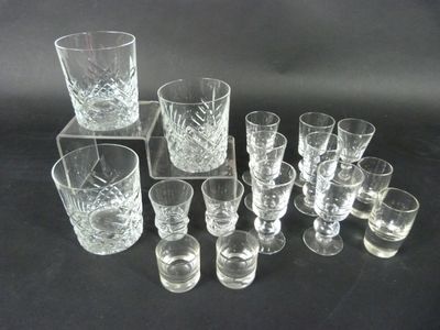 a lot of glasses that are sitting on a table