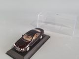 a toy car that is sitting on a display case