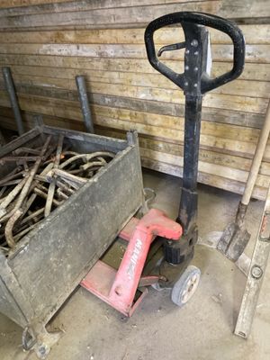 a picture of a fork and a cart in a garage