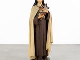a statue of a woman holding a bird in her hands