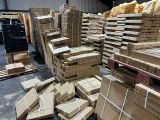 a large amount of boxes stacked on a pallet in a warehouse