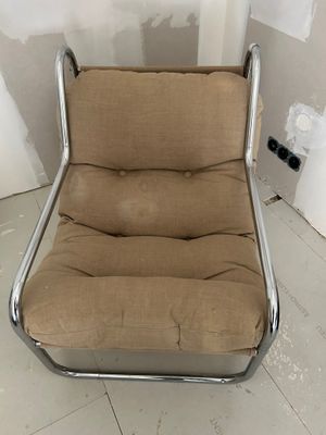 a chair that is sitting in the middle of a room