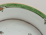 a close up of a plate with flowers on it