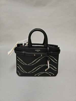 a small black handbag with silver studding on the handle