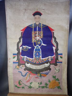 une ancienne peinture chinoise représentant un homme assis sur une chaise