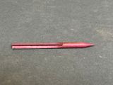 a pink pen that has been left on the table