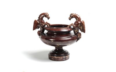 un vase marron surmonté de deux oiseaux
