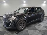the black suv is parked on a checkered floor in the garage