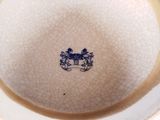 a white plate with a blue and white design on it