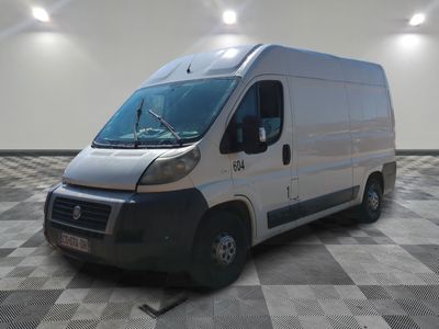 a picture of a white van parked in a room