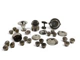a lot of silver objects that are on a white surface