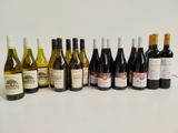 many bottles of wine lined up on the table