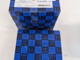three blue boxes stacked on top of each other on a table
