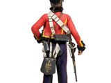 figurine of a british soldier in uniform holding a rifle