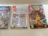 three nintendo wii games are sitting on a counter top