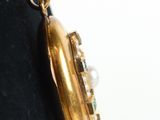 a close up of a gold locke on a mannequin dummy