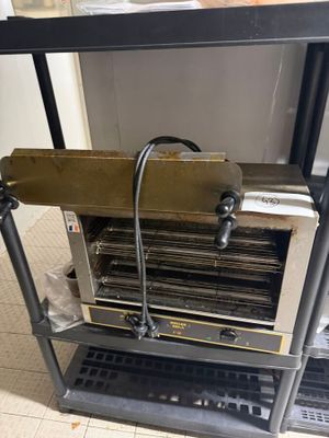 a machine that is sitting on a table in a kitchen