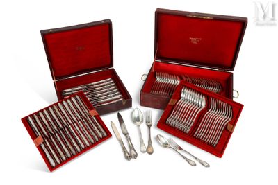 several silverware items in a red case on a white surface