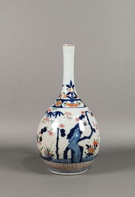 a white vase with a blue and white design on it