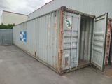 a large container sitting in the middle of a parking lot