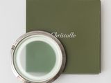 a close up of a green box with a mirror on it