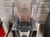 a blender that is sitting on a counter in a kitchen