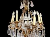 an image of a chandelier made of glass and brass
