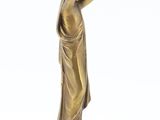 bronze statue of a woman holding a bird on a marble base