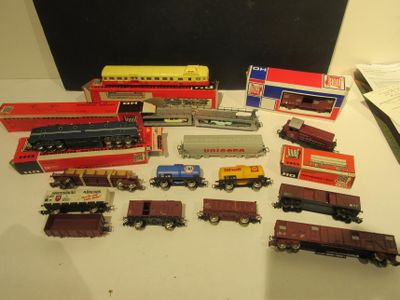 many different types of toy trains on the table