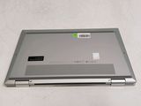 a laptop that is sitting on a white surface