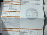 a picture of a receipt with a picture of a car ' s driver ' s license on it