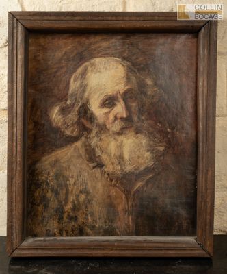 un vieux tableau représentant un homme barbu, dans un cadre en bois