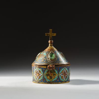 an ornately decorated box with a cross on top of it