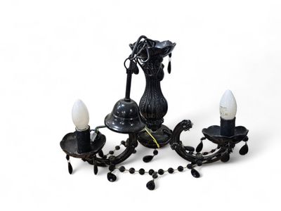 a picture of a black chandelier with three lights