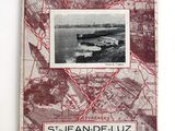 an old book with a picture of a city on it
