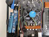 a close up of a computer motherboard with wires and a fan