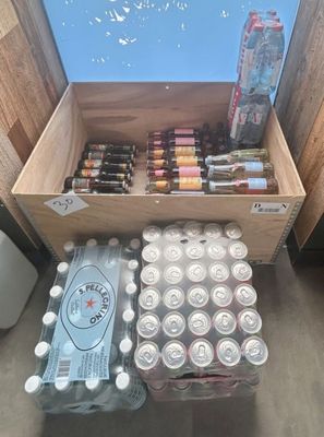 many cans of beer and cans of soda on the floor