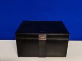 an empty black box sitting on top of a white table