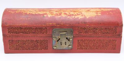 a red box with a lock on it on a white surface