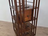 an image of a wooden shelf with a drawer on top of it