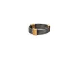 a close up of a black and gold bracelet on a white background