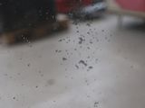 a blurry picture of a window with a bus in the background