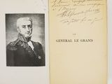 someone is holding a book with a picture of a man in a military uniform