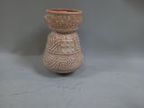 a small vase that is sitting on a table