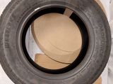 a tire that is sitting in a box on the floor