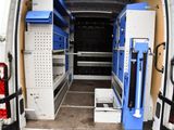 a white van with a blue door and some shelves in the back of it