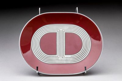 a red and white plate with a letter d on it